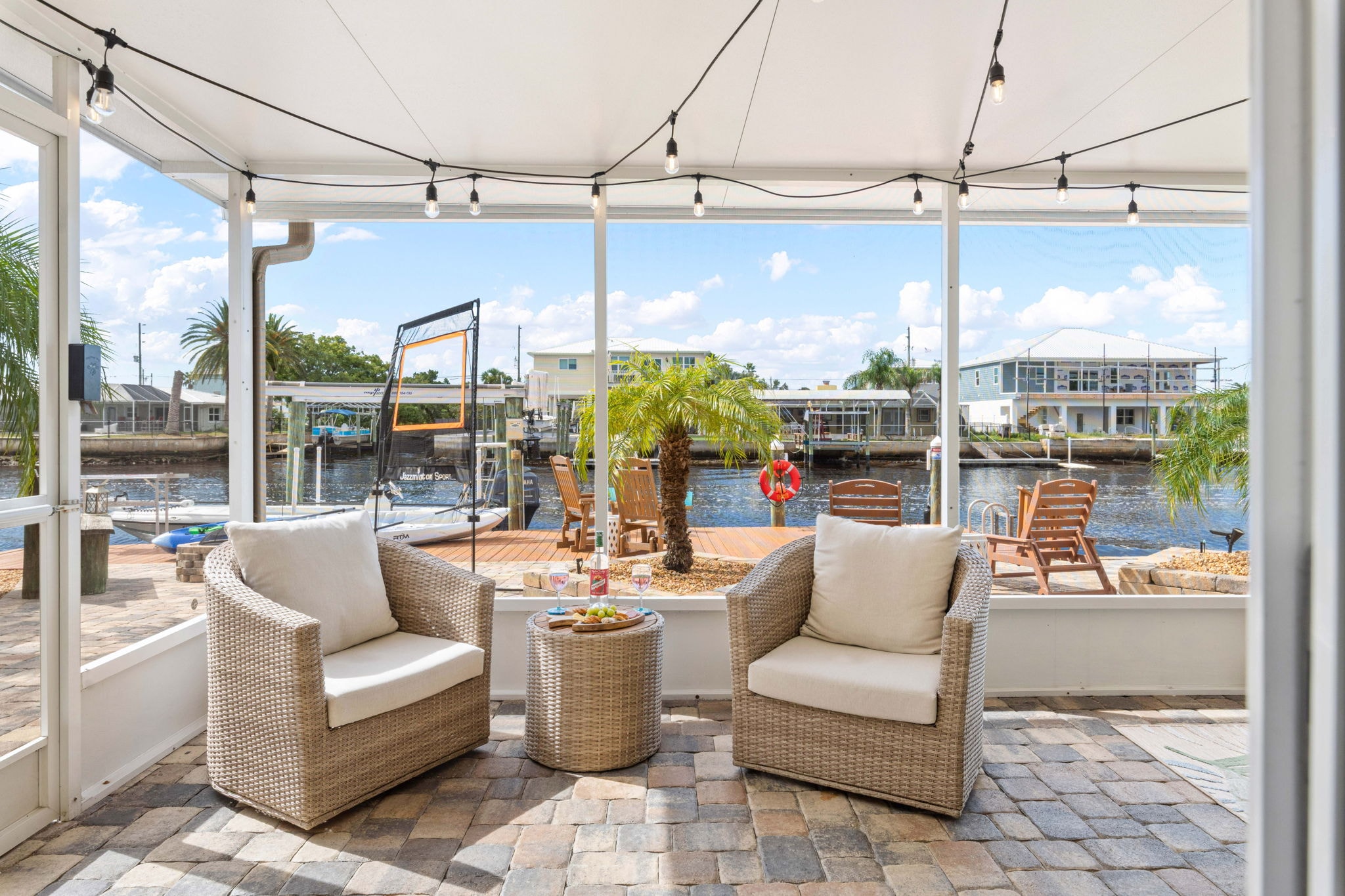 Dock with Adirondack chairs and canal view